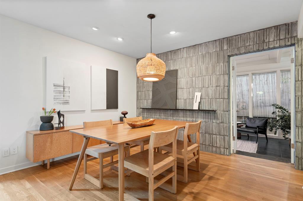 7320 Walling Lane Dallas, TX 75231 - Photo 13 of 40 a kitchen with a dining table chairs and white cabinets