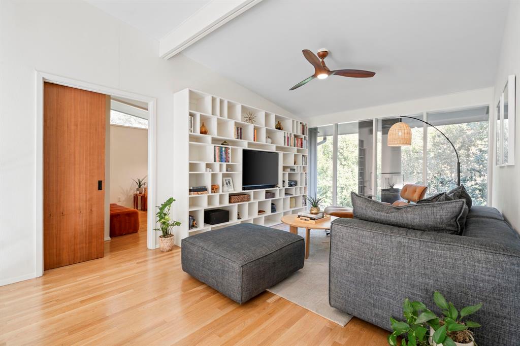 7320 Walling Lane Dallas, TX 75231 - Photo 16 of 40 a living room with furniture fireplace and a flat screen tv