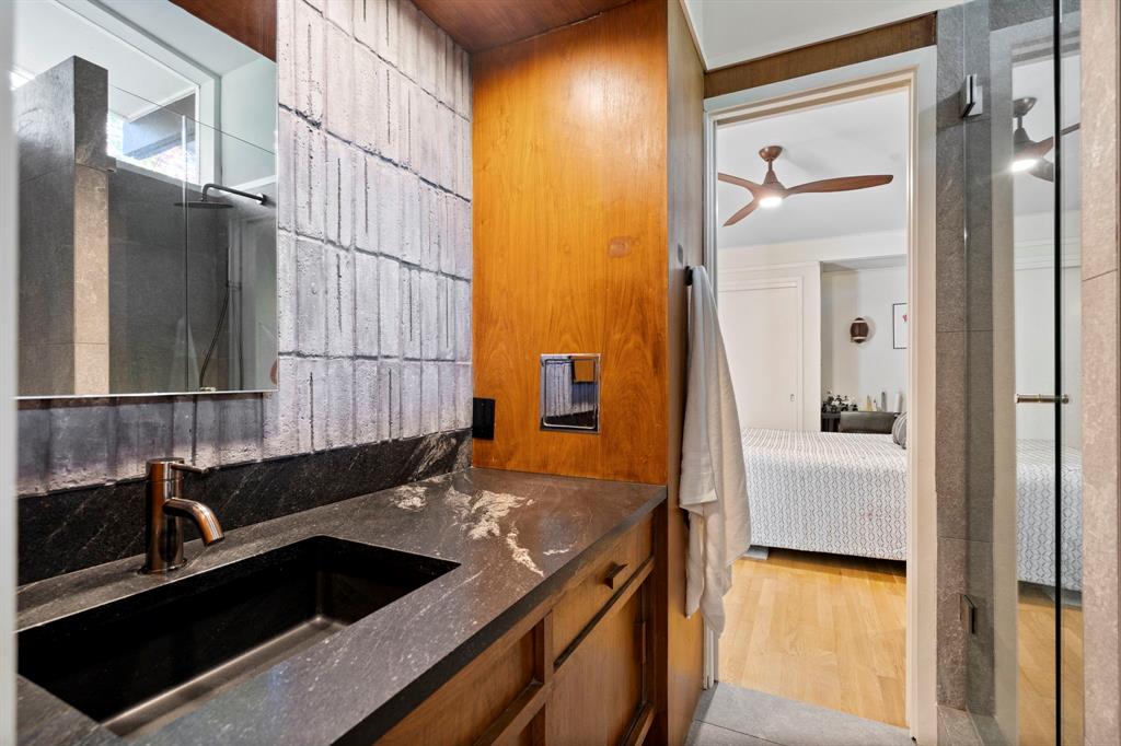 7320 Walling Lane Dallas, TX 75231 - Photo 25 of 40 a bathroom with a sink and a mirror