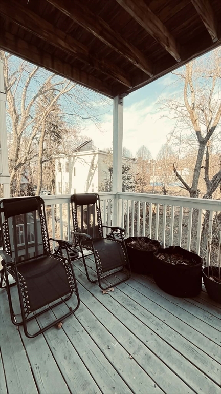 3 Nira Avenue, Unit 2 Boston, MA 02130 - Photo 8 of 9 a living room with furniture water view and large trees