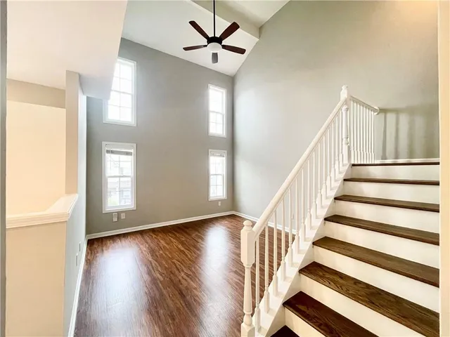 a view of entryway and hall with wooden floor