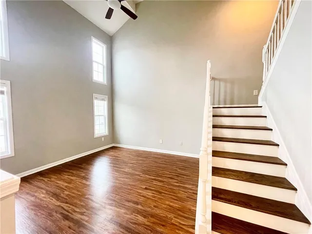 a view of a livingroom with wooden floor and window