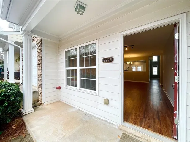 a view of a brick house with a large window
