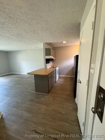 a view of kitchen with furniture and wooden floor
