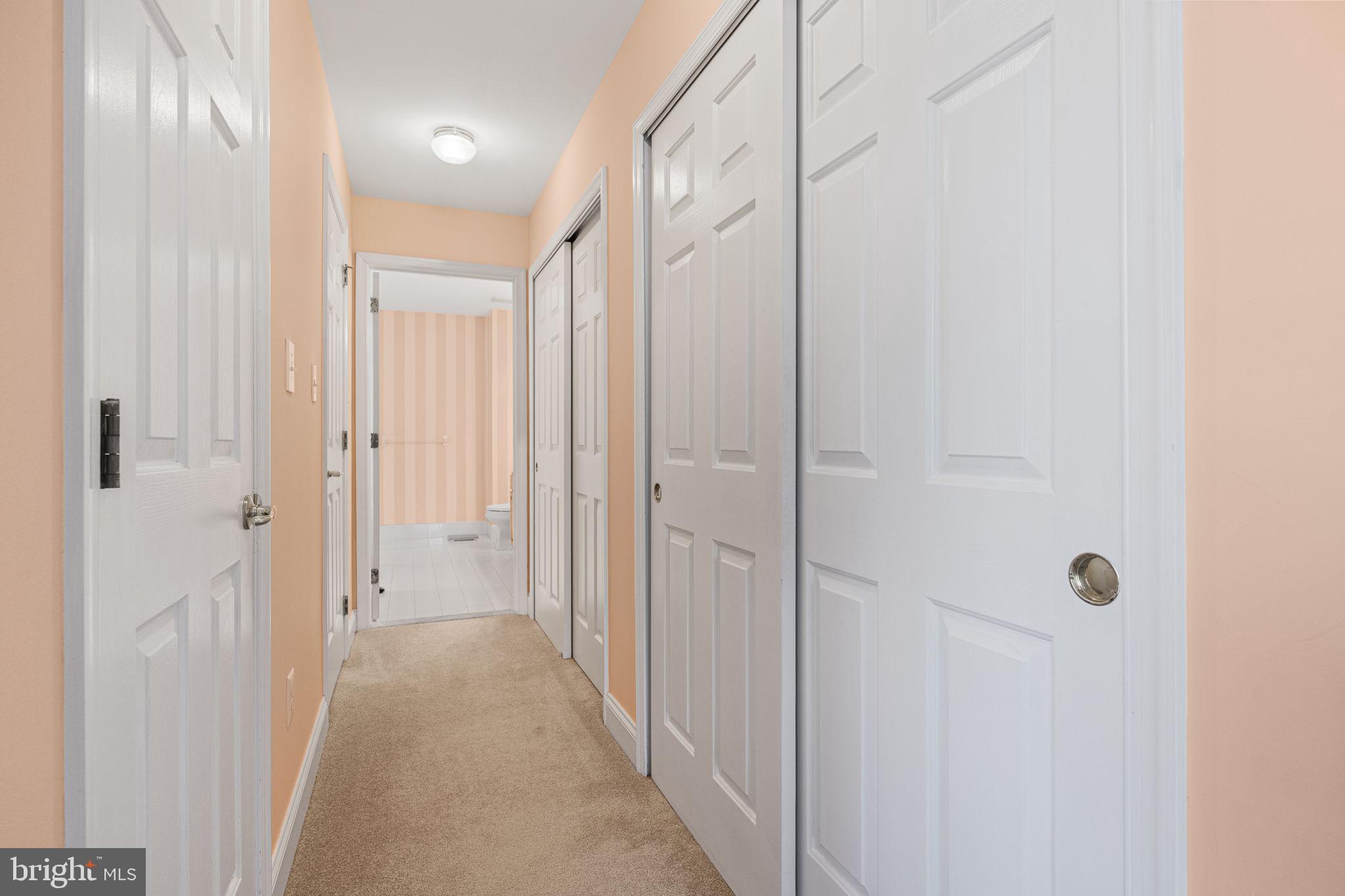24 Longview Lane Newtown Square, PA 19073 - Photo 17 of 32 a view of a hallway with wooden floor