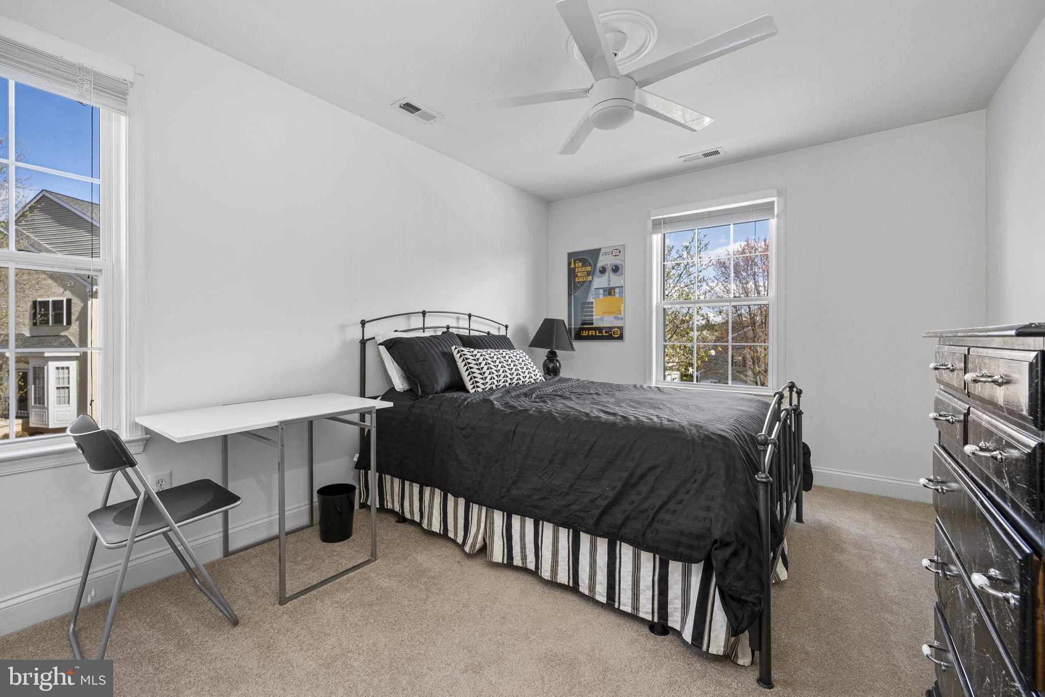 24 Longview Lane Newtown Square, PA 19073 - Photo 22 of 32 a bedroom with a bed a window and book shelf