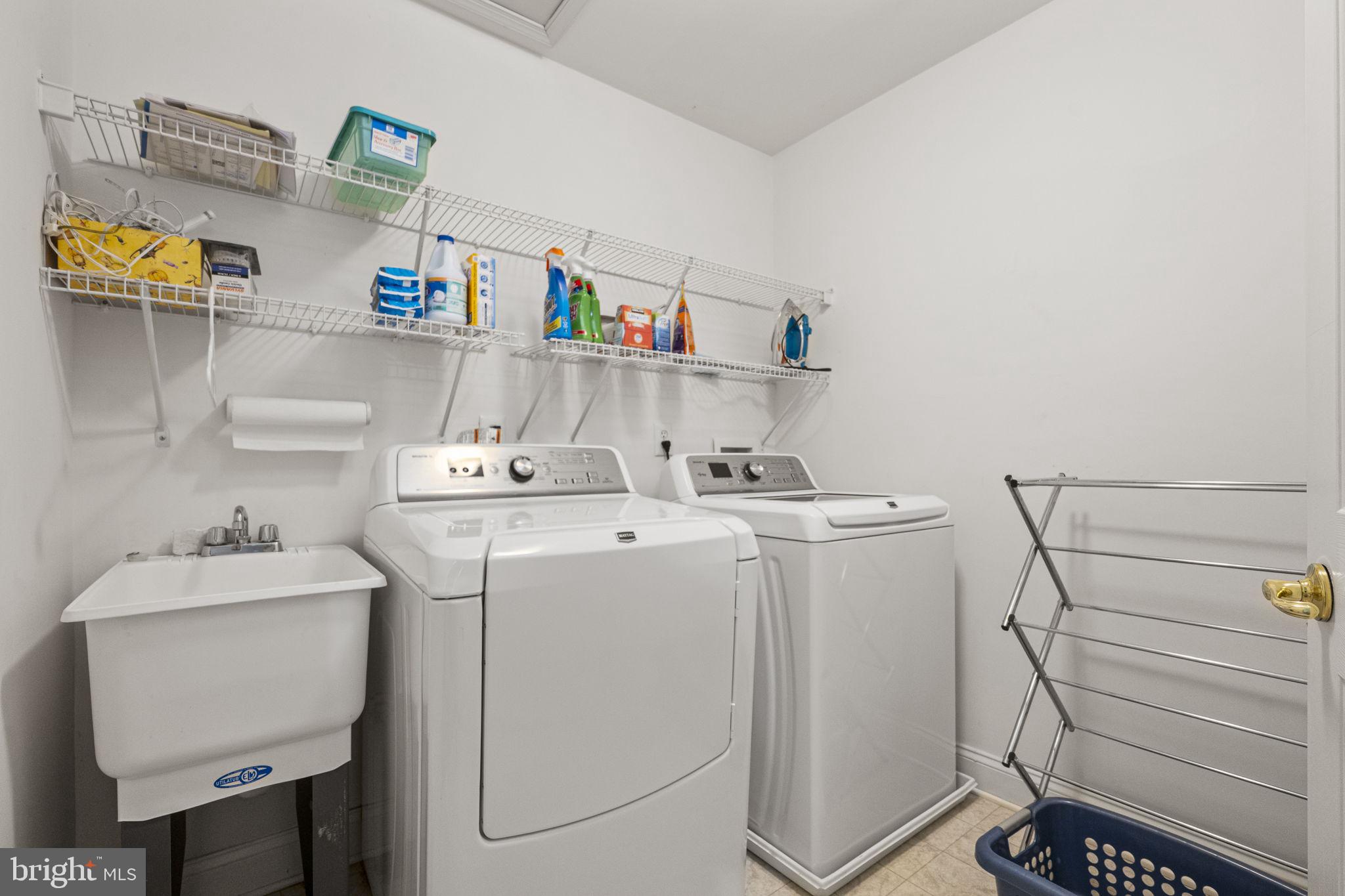 24 Longview Lane Newtown Square, PA 19073 - Photo 23 of 32 a utility room with dryer and washer