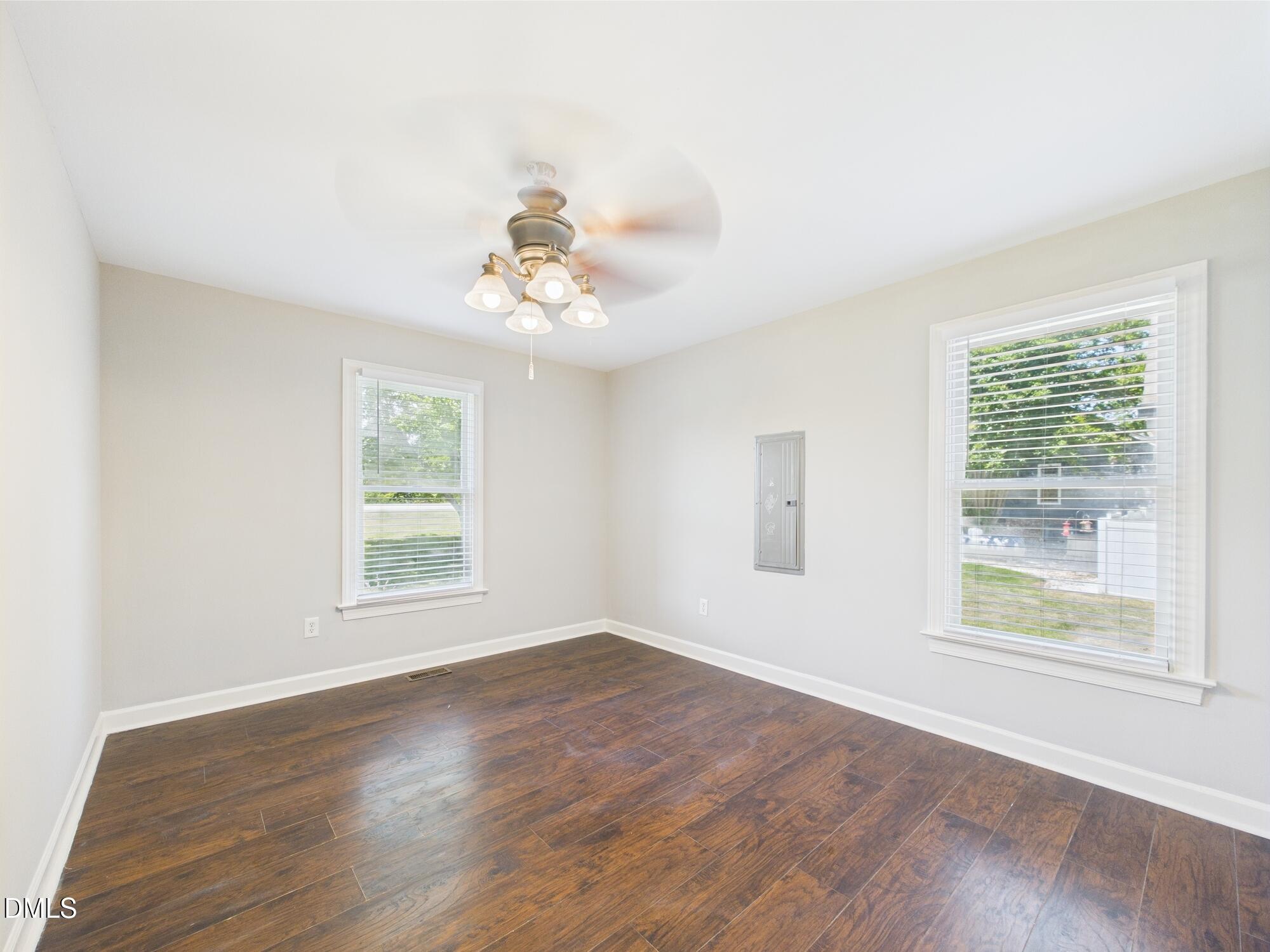 10917 Fanny Brown Road Raleigh, NC 27603 - Photo 31 of 54 a view of an empty room with a window and wooden floor