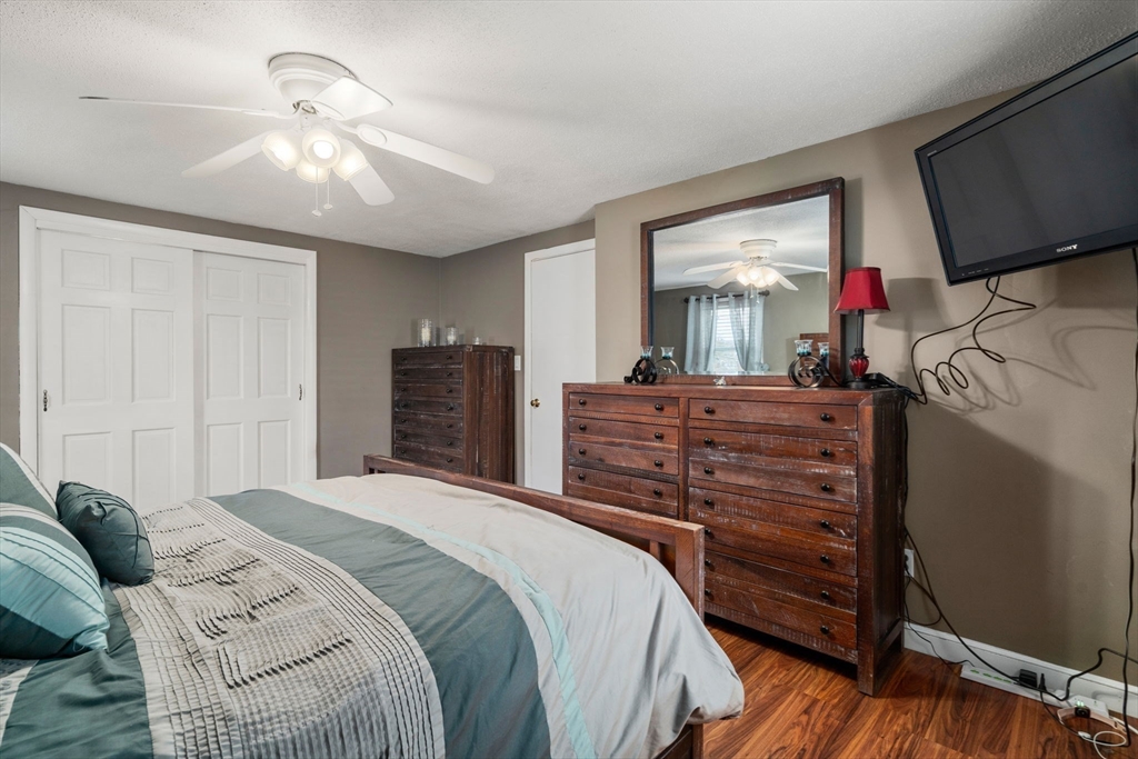 15 Farrin Street Boston, MA 02136 - Photo 12 of 22 a bedroom with a bed and a flat screen tv