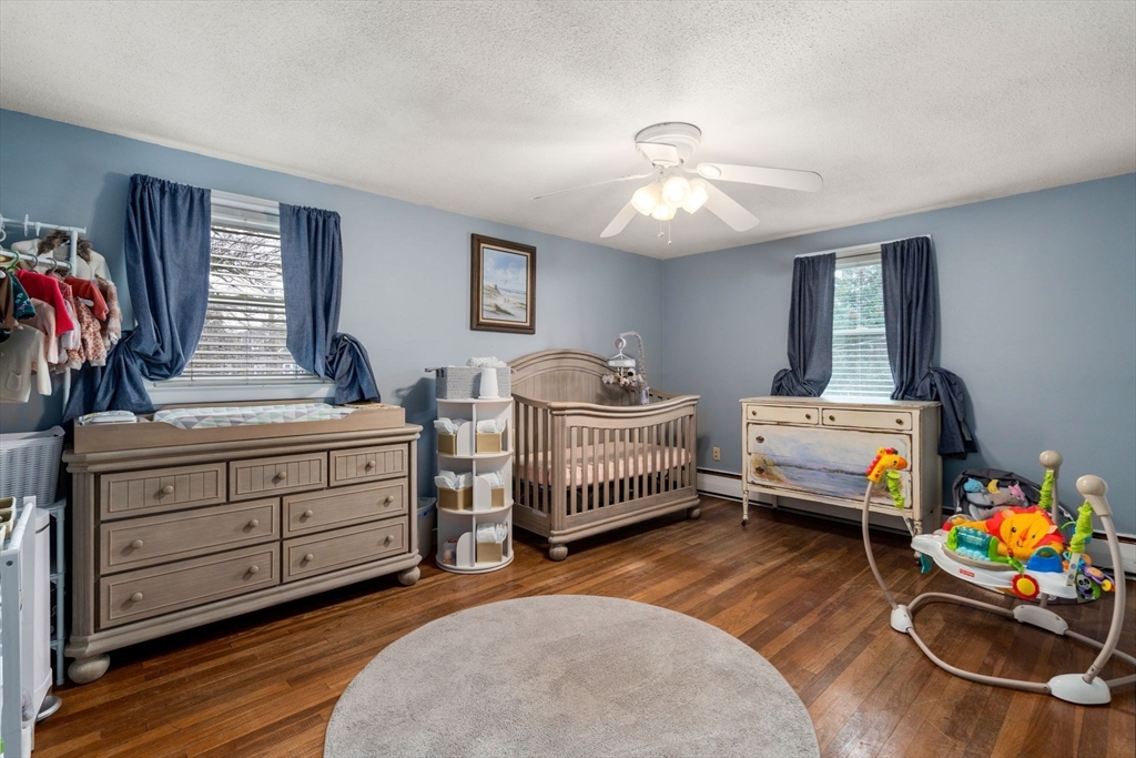 15 Farrin Street Boston, MA 02136 - Photo 13 of 22 a bedroom with bed and a chandelier
