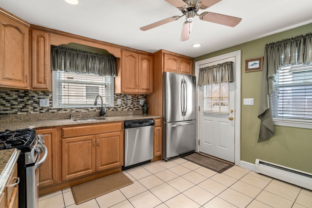15 Farrin Street Boston, MA 02136 - Photo 5 of 22 a kitchen with stainless steel appliances granite countertop a refrigerator and a sink