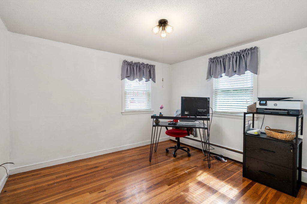 15 Farrin Street Boston, MA 02136 - Photo 9 of 22 a workspace with furniture hardwood and a window