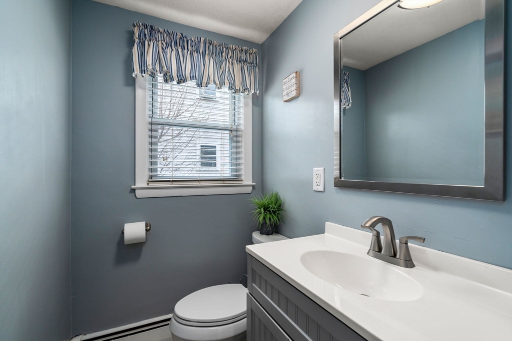 15 Farrin Street Boston, MA 02136 - Photo 10 of 22 a bathroom with a sink toilet and window