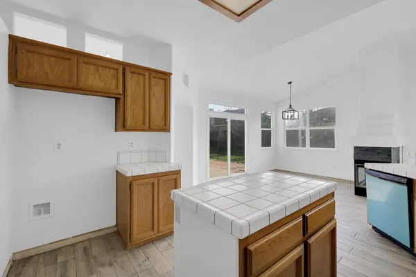 a kitchen with a stove and a kitchen island