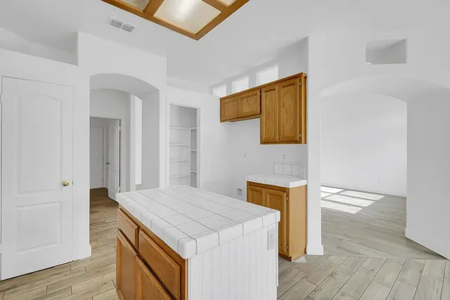 a kitchen that has a sink and a stove