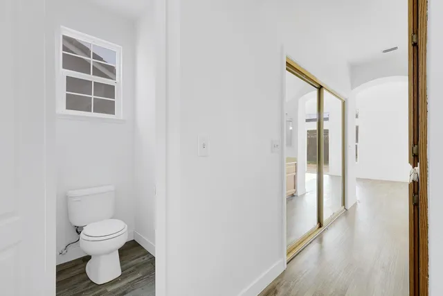 a bathroom with a toilet and a shower
