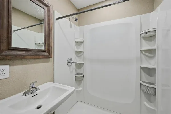 a bathroom with a sink and a mirror