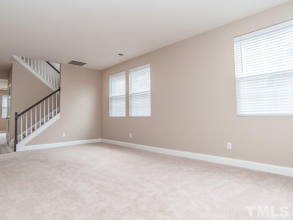 6040 Ricker Road Raleigh, NC 27610 - Photo 12 of 25 a view of an empty room with a window