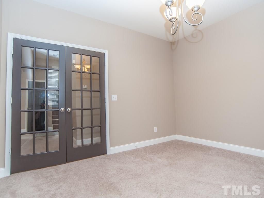6040 Ricker Road Raleigh, NC 27610 - Photo 13 of 25 a view of empty room with windows