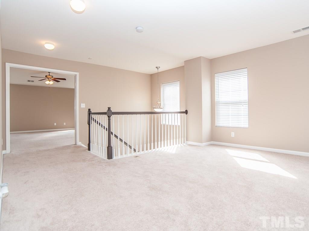 6040 Ricker Road Raleigh, NC 27610 - Photo 16 of 25 a view of an empty room with a window