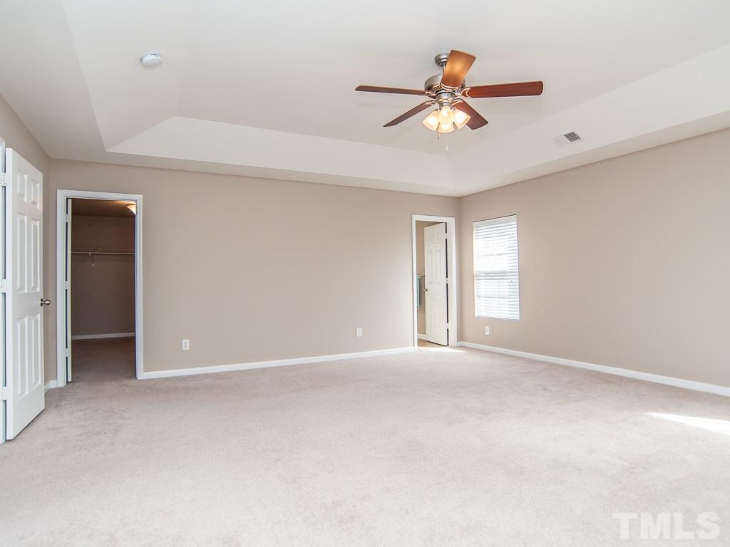 6040 Ricker Road Raleigh, NC 27610 - Photo 18 of 25 a view of an empty room with a window