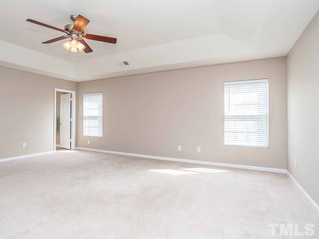 6040 Ricker Road Raleigh, NC 27610 - Photo 19 of 25 a view of an empty room with a window