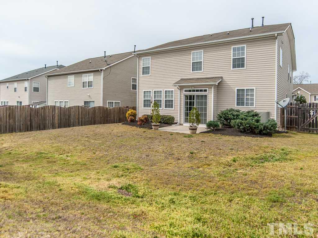6040 Ricker Road Raleigh, NC 27610 - Photo 24 of 25 a front view of house with yard