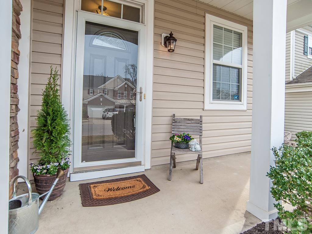 6040 Ricker Road Raleigh, NC 27610 - Photo 25 of 25 a backyard of a house with barbeque oven table and chairs