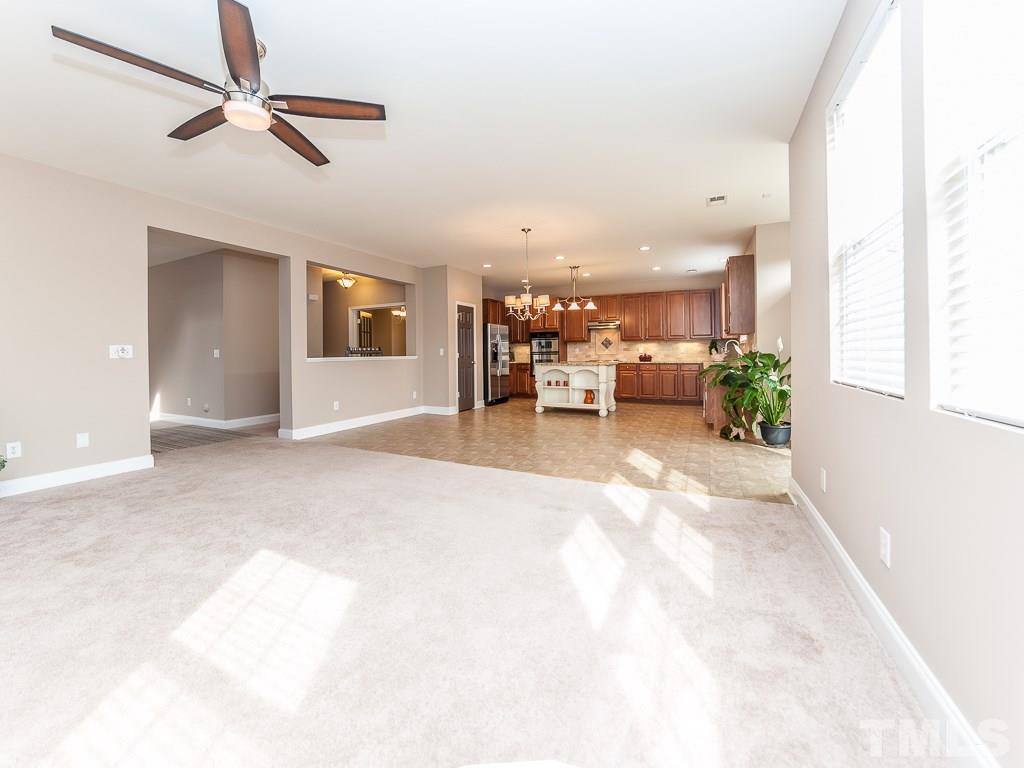 6040 Ricker Road Raleigh, NC 27610 - Photo 10 of 25 a view of livingroom with furniture and ceiling fan