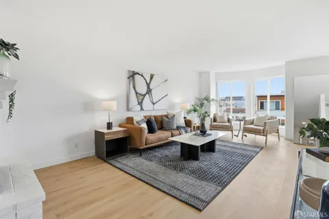 a living room with furniture and a rug