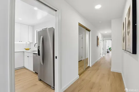 a view of a kitchen with a refrigerator a sink and dishwasher refrigerator