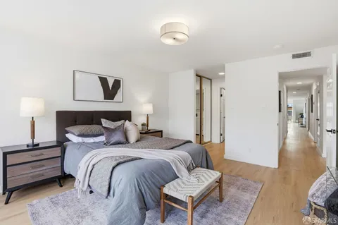 a bed room with a bed and a couch