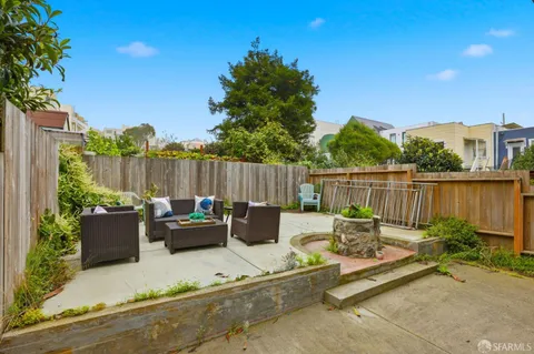 a patio with patio a couch and chairs