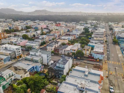 an aerial view of a city with lots of residential buildings