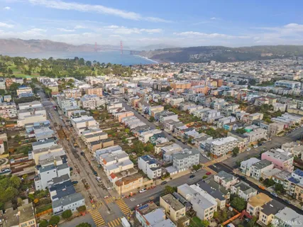 an aerial view of residential building with city view