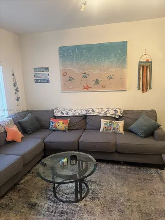 a kitchen with a refrigerator stove and microwave