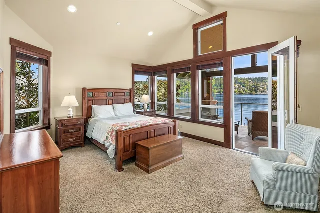 a bed room with a bed and a large window