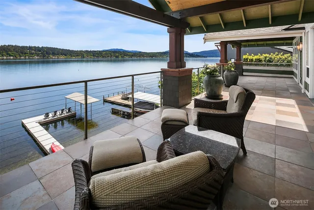 a view of a balcony with couch and wooden floor