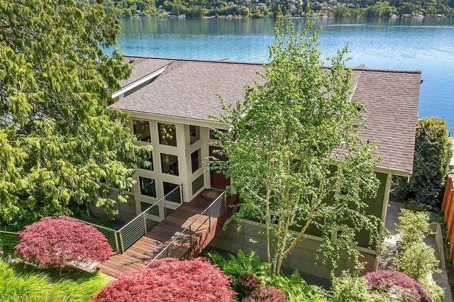 an aerial view of a house with a lake view