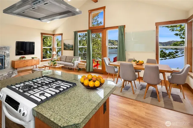a living room with patio furniture and a flat screen tv