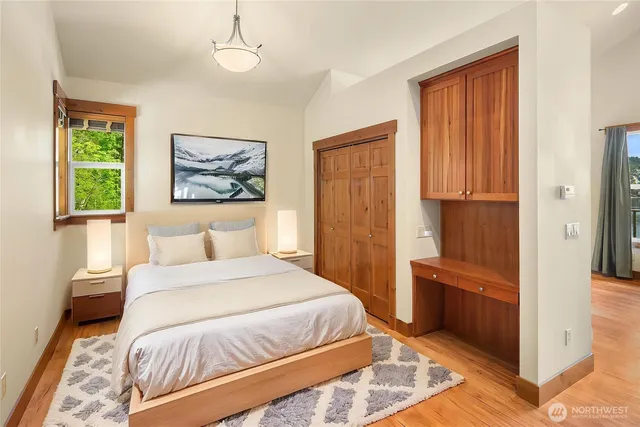 a bedroom with a bed and a window