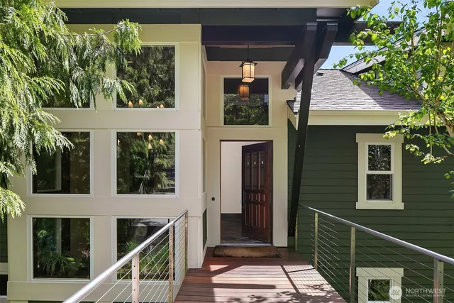 a view of a balcony with wooden floor and plants