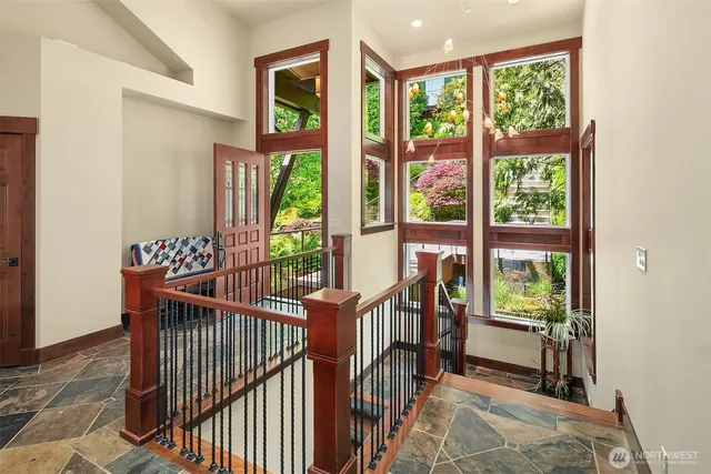 a view of a porch with furniture and garden