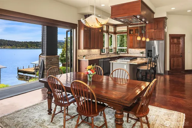 a dining room with furniture and wooden floor