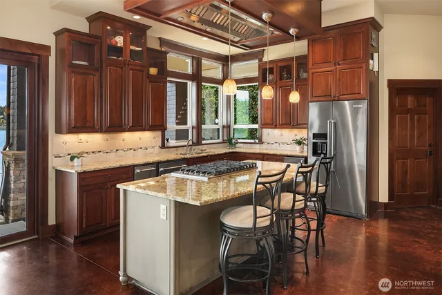 a dinning table and chairs in a kitchen