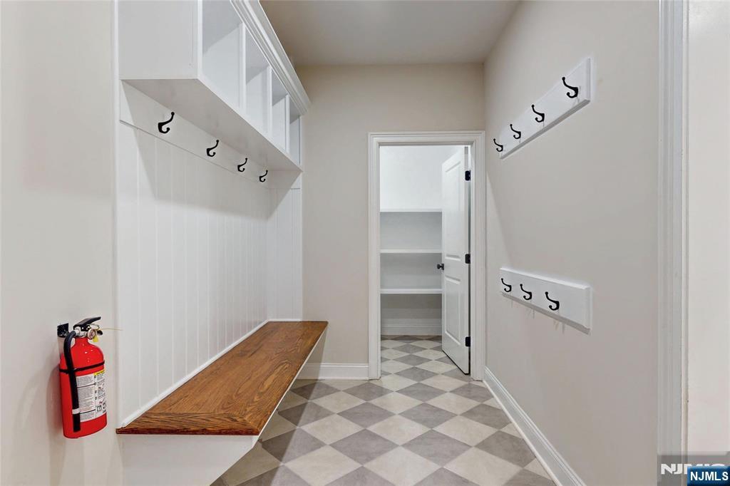 19 Meadowbrook Road Upper Saddle River, NJ 07458 - Photo 14 of 47 wooden floor with white walls and cabinet