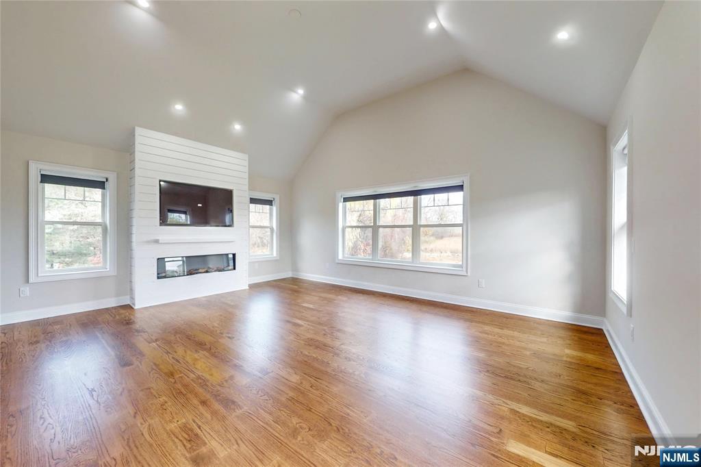 19 Meadowbrook Road Upper Saddle River, NJ 07458 - Photo 20 of 47 an empty room with wooden floor and windows