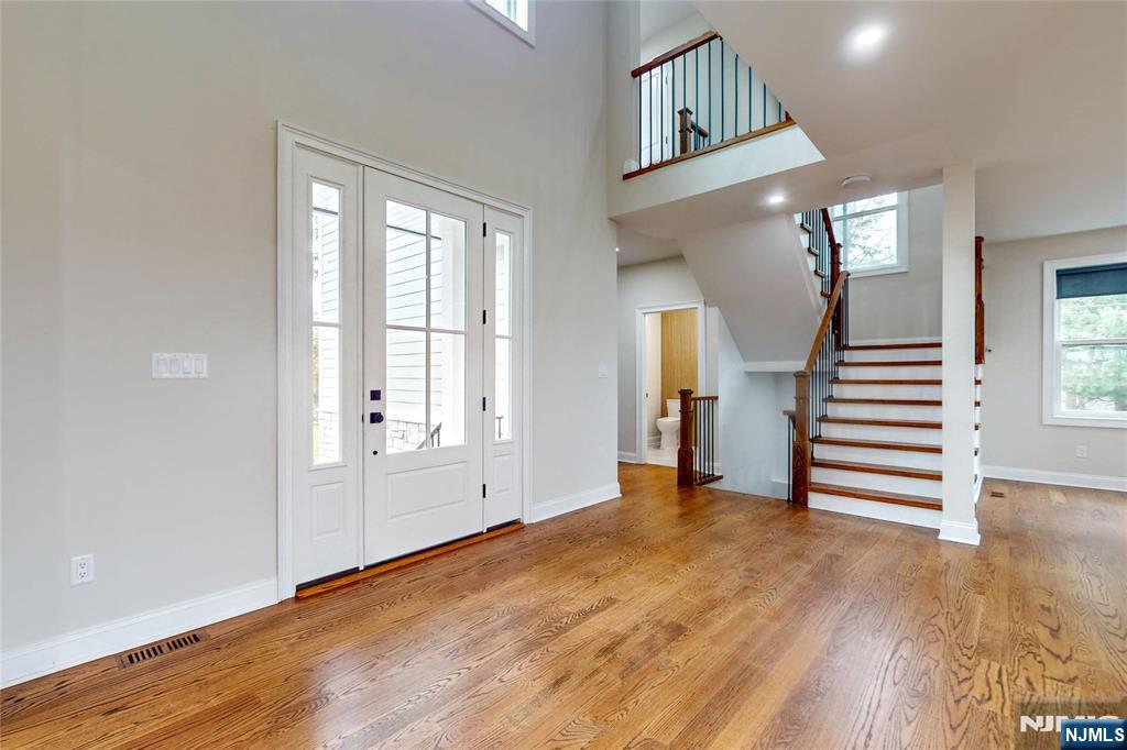 19 Meadowbrook Road Upper Saddle River, NJ 07458 - Photo 2 of 47 wooden floor in an empty room with a window