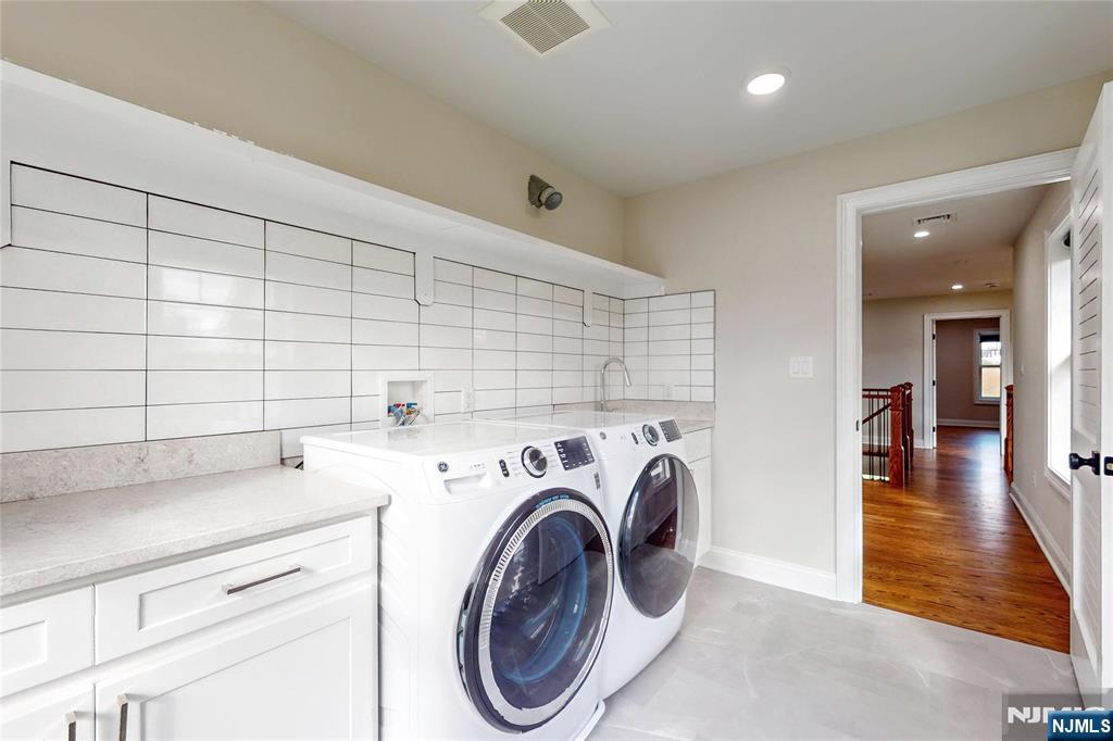 19 Meadowbrook Road Upper Saddle River, NJ 07458 - Photo 27 of 47 a utility room with dryer and washer