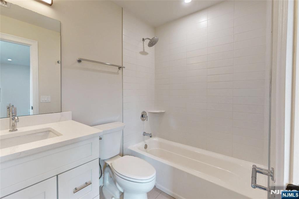 19 Meadowbrook Road Upper Saddle River, NJ 07458 - Photo 30 of 47 a bathroom with a sink toilet vanity and shower